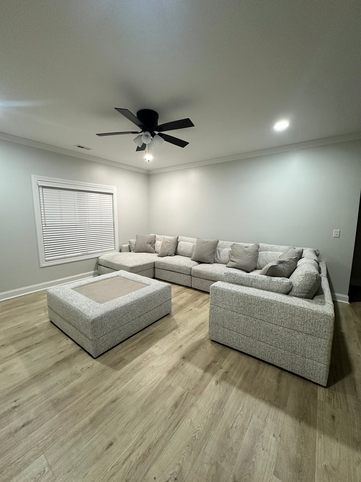 Alcott sectional with chaise and oversized ottoman in a customer's home